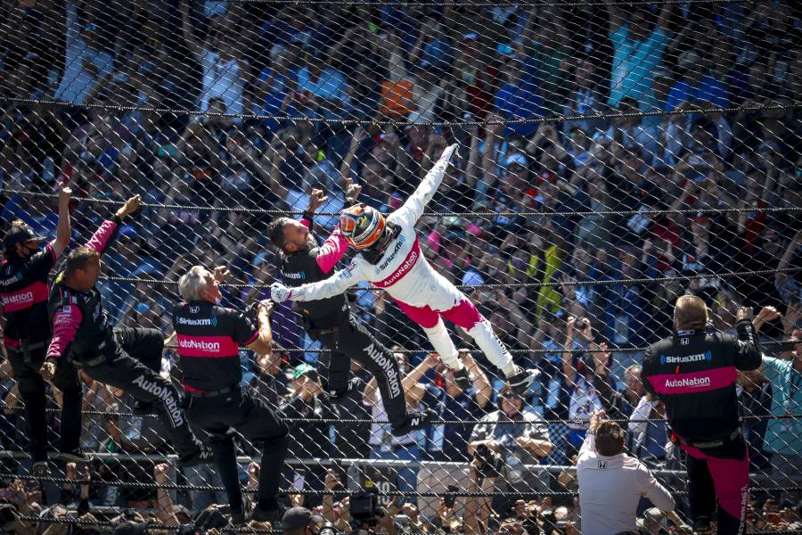 Helio Castroneves entertained the crowd with a Spiderman performance