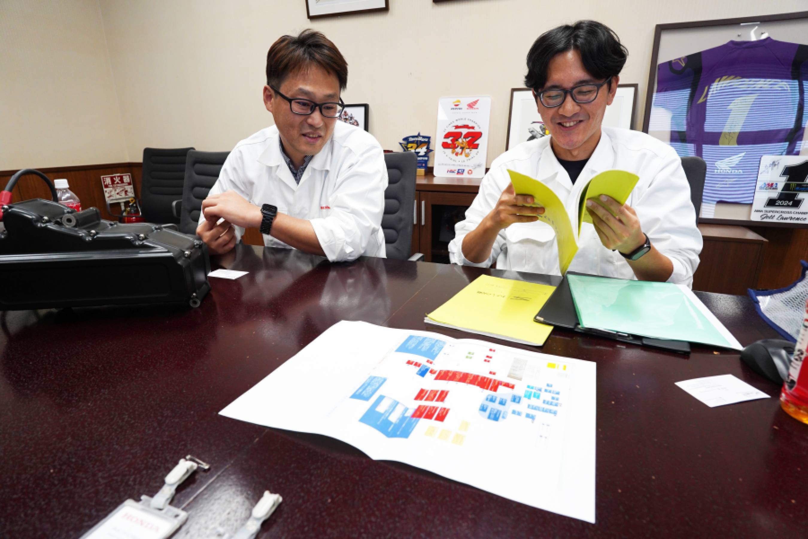 Two associates discussing the mapping family tree