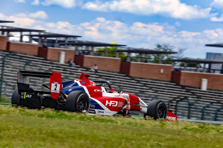 Kakunoshin Ohta on the podium in second place